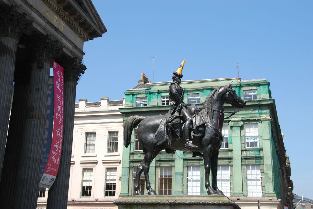 Statue of King George IV (1761 - 1830) - Apparently pigeons aren't the only creatures that show no respect for statues.  Traffic pylons on the heads of statues - including the horses' heads - are a common sight in the square.